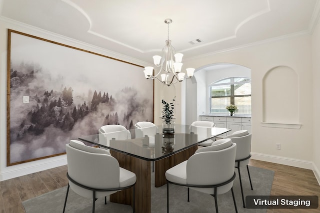 29407 Amber Meadows Ct, Katy, TX 77494 - dining room with a chandelier, dark wood-type flooring, arched walkways, baseboards, and ornamental molding