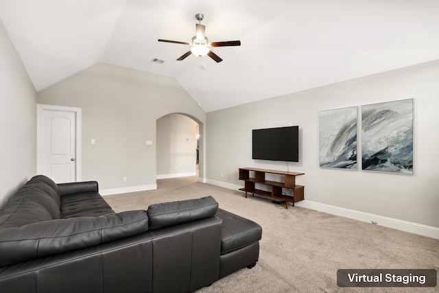 29407 Amber Meadows Ct, Katy, TX 77494 - carpeted living room featuring ceiling fan, arched walkways, vaulted ceiling, and baseboards