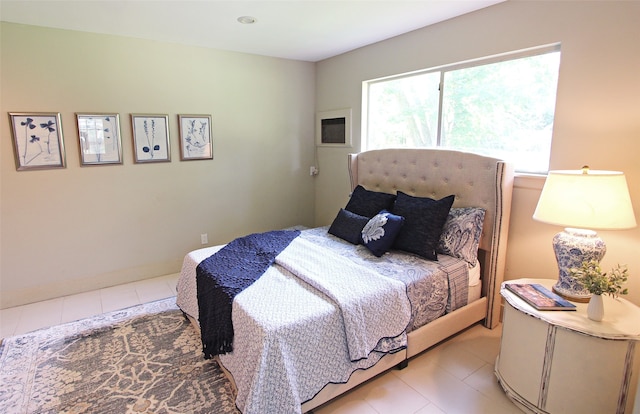 bedroom featuring light tile patterned floors