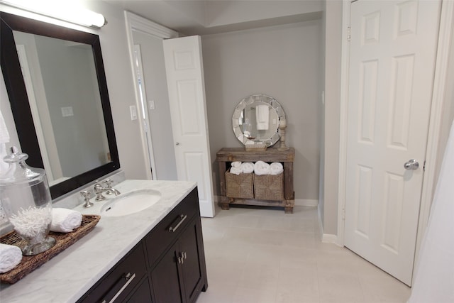 bathroom with vanity and baseboards