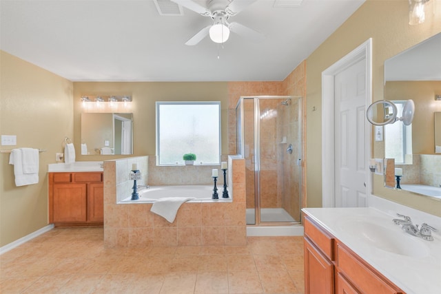 1078 Lasso Ct, Alvin, TX 77511 - bathroom with a stall shower, tile patterned flooring, a garden tub, ceiling fan, and two vanities