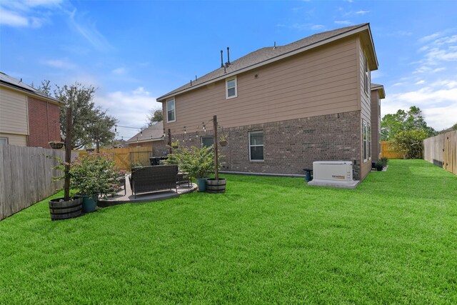 1078 Lasso Ct, Alvin, TX 77511 - back of property with brick siding and a patio