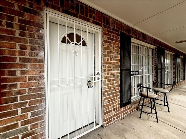 6405 Westward St Unit 96, Houston, TX 77081 - entrance to property with brick siding and a porch