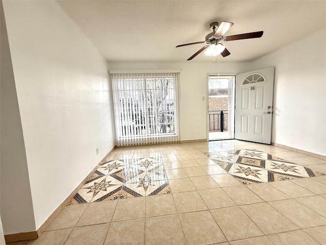 6405 Westward St Unit 96, Houston, TX 77081 - foyer entrance with tile patterned floors, ceiling fan, and baseboards