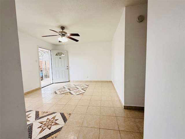 6405 Westward St Unit 96, Houston, TX 77081 - foyer entrance featuring light tile patterned flooring, ceiling fan, and baseboards