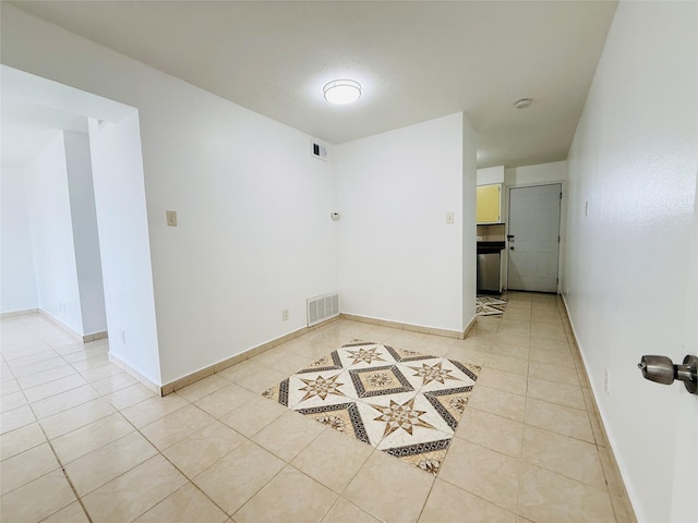 6405 Westward St Unit 96, Houston, TX 77081 - empty room featuring light tile patterned flooring and baseboards