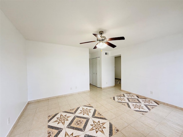 6405 Westward St Unit 96, Houston, TX 77081 - spare room with ceiling fan, light tile patterned floors, and baseboards