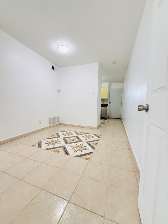 6405 Westward St Unit 96, Houston, TX 77081 - empty room with light tile patterned floors and baseboards