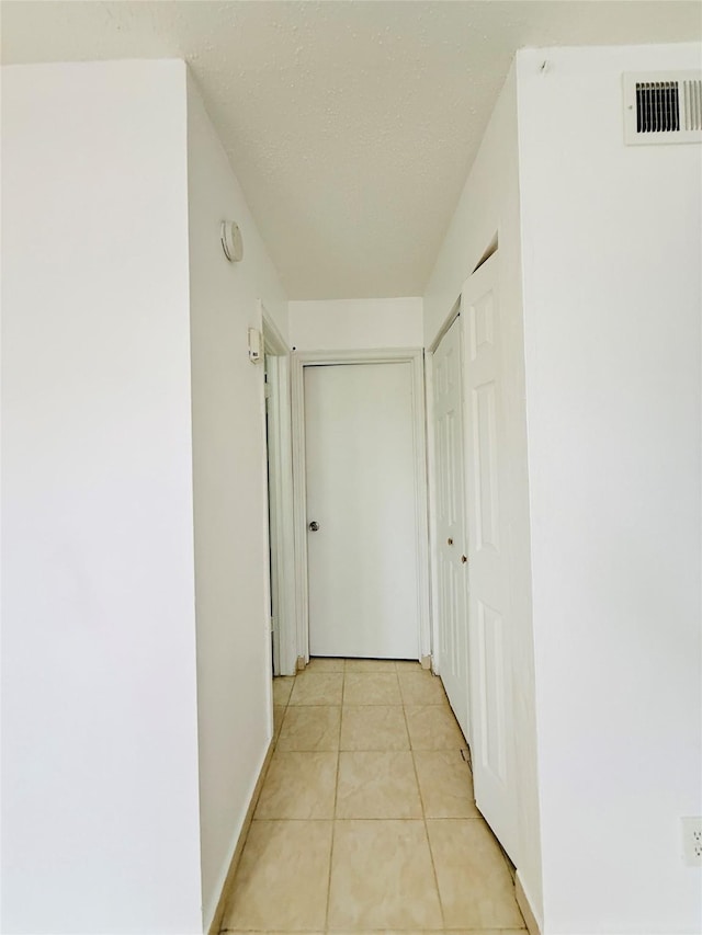 6405 Westward St Unit 96, Houston, TX 77081 - hallway featuring light tile patterned flooring