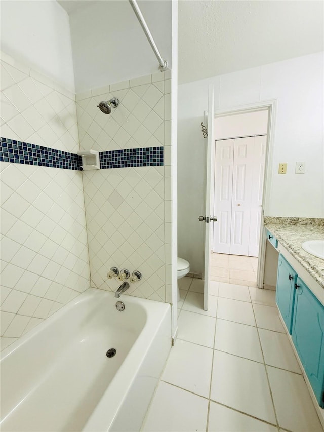 6405 Westward St Unit 96, Houston, TX 77081 - bathroom featuring tile patterned floors, vanity, toilet, and washtub / shower combination
