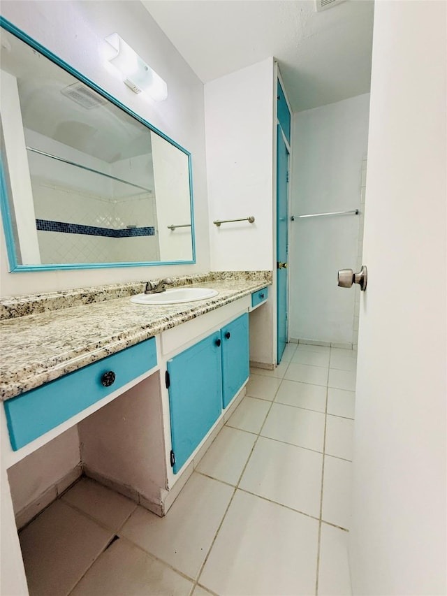 6405 Westward St Unit 96, Houston, TX 77081 - full bath featuring tile patterned floors, vanity, and a shower