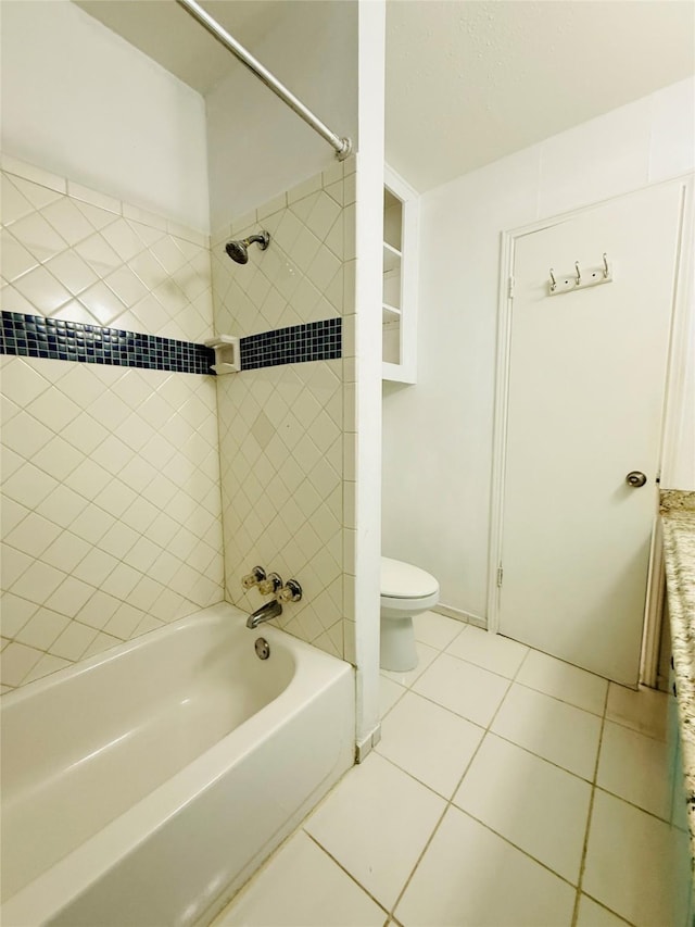 6405 Westward St Unit 96, Houston, TX 77081 - bathroom featuring tile patterned floors, toilet, and  shower combination