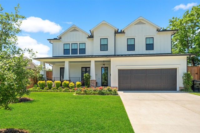 1221 Lamonte Ln, Houston, TX 77018 - modern farmhouse style home with board and batten siding, a front yard, a garage, and driveway