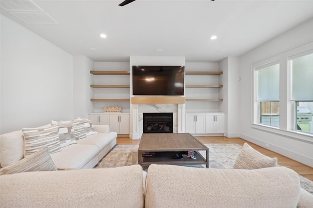 1221 Lamonte Ln, Houston, TX 77018 - living area with a fireplace, a ceiling fan, recessed lighting, light wood-type flooring, and baseboards