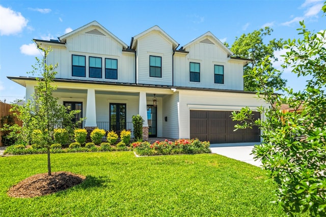 1221 Lamonte Ln, Houston, TX 77018 - view of front facade featuring board and batten siding, an attached garage, a front lawn, and concrete driveway