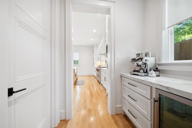1221 Lamonte Ln, Houston, TX 77018 - hallway with beverage cooler, light wood-style floors, healthy amount of natural light, and recessed lighting