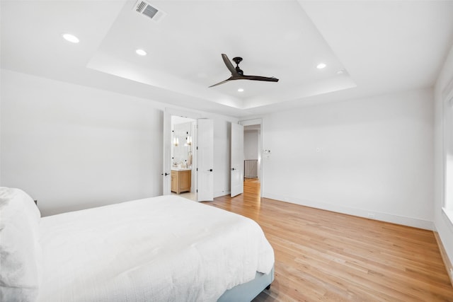 1221 Lamonte Ln, Houston, TX 77018 - bedroom with a tray ceiling, recessed lighting, light wood-type flooring, baseboards, and ceiling fan