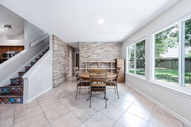 22331 Unicorns Horn Ln, Katy, TX 77449 - dining area with light tile patterned flooring, stairway, and baseboards
