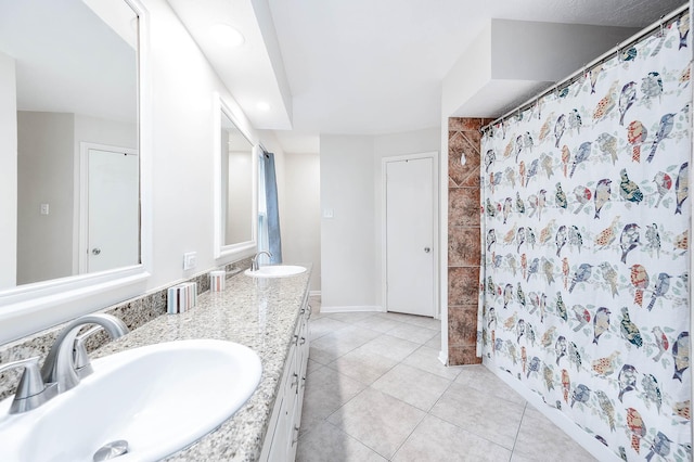 22331 Unicorns Horn Ln, Katy, TX 77449 - full bath featuring double vanity, tile patterned floors, a shower with shower curtain, baseboards, and recessed lighting