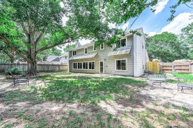 22331 Unicorns Horn Ln, Katy, TX 77449 - back of house with a fenced backyard and a patio area