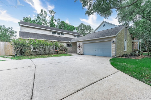 22331 Unicorns Horn Ln, Katy, TX 77449 - traditional-style home featuring a garage, driveway, brick siding, and roof with shingles