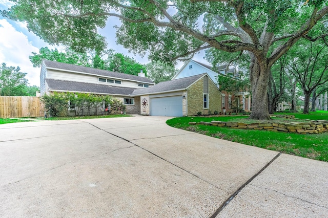 22331 Unicorns Horn Ln, Katy, TX 77449 - traditional home with a garage, driveway, and brick siding