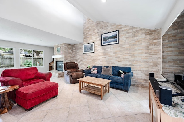 22331 Unicorns Horn Ln, Katy, TX 77449 - living room with light tile patterned floors, brick wall, and a glass covered fireplace