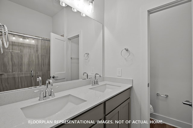 975 Oak Mist Ln, Magnolia, TX 77354 - full bathroom featuring toilet, double vanity, and tiled shower