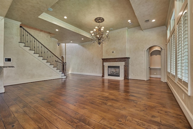 61 Parkgate, Shenandoah, TX 77381 - unfurnished living room with arched walkways, wood-type flooring, a high end fireplace, ornamental molding, and a chandelier