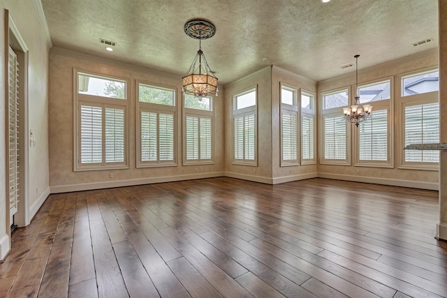61 Parkgate, Shenandoah, TX 77381 - unfurnished sunroom with a chandelier, hardwood / wood-style floors, baseboards, crown molding, and a textured ceiling