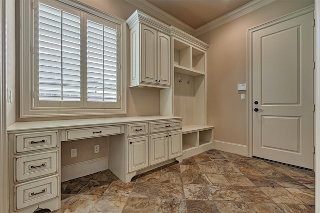 61 Parkgate, Shenandoah, TX 77381 - mudroom with ornamental molding, built in desk, stone finish floors, and baseboards
