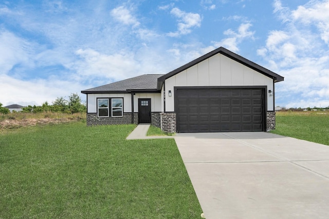 6273 Rd 5503, Cleveland, TX 77327 - view of front facade featuring a front lawn, an attached garage, concrete driveway, and board and batten siding