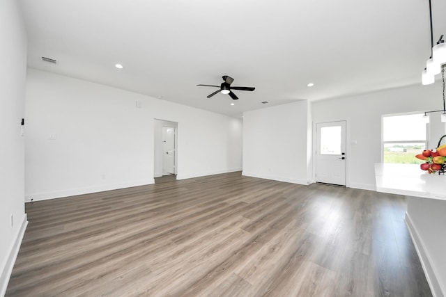 6273 Rd 5503, Cleveland, TX 77327 - unfurnished living room featuring ceiling fan, wood finished floors, recessed lighting, and baseboards