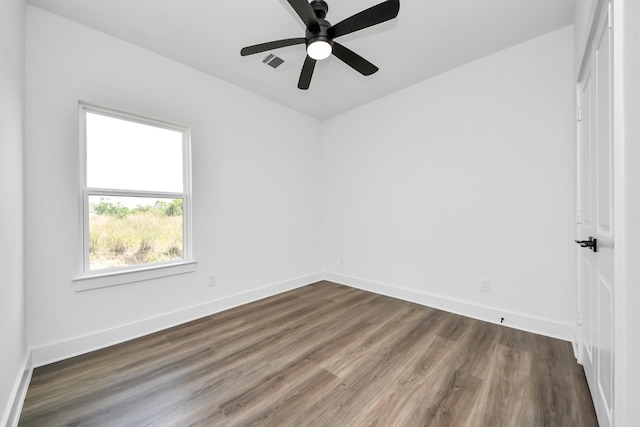 6273 Rd 5503, Cleveland, TX 77327 - spare room with dark wood-style flooring, baseboards, and ceiling fan