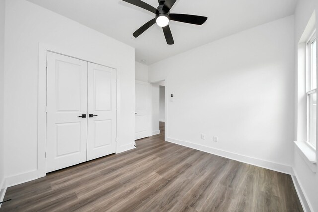 6273 Rd 5503, Cleveland, TX 77327 - unfurnished bedroom featuring wood finished floors, a closet, baseboards, and ceiling fan