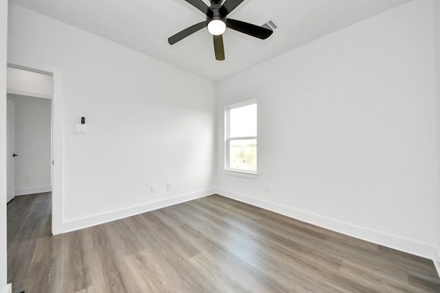 6273 Rd 5503, Cleveland, TX 77327 - empty room with wood finished floors, baseboards, and ceiling fan