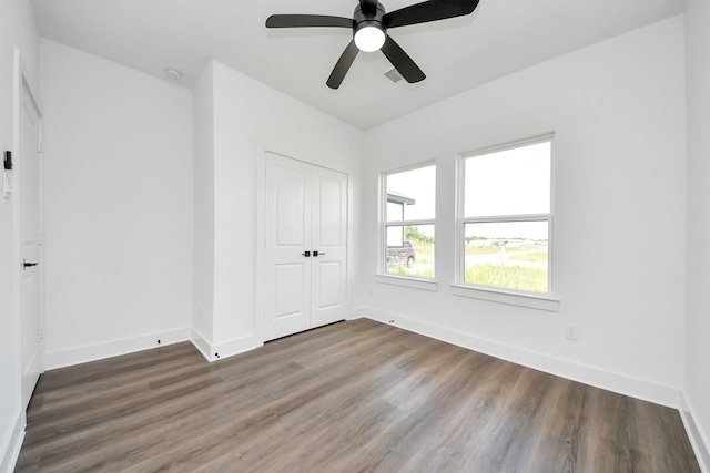 6273 Rd 5503, Cleveland, TX 77327 - unfurnished bedroom with wood finished floors, a closet, baseboards, and ceiling fan