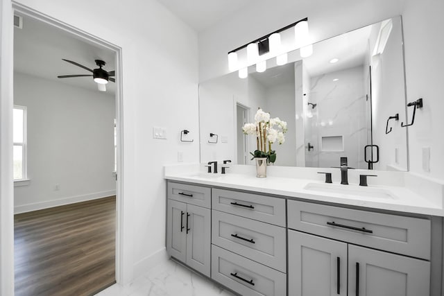 6273 Rd 5503, Cleveland, TX 77327 - full bath featuring baseboards, a ceiling fan, a marble finish shower, double vanity, and marble look tile flooring