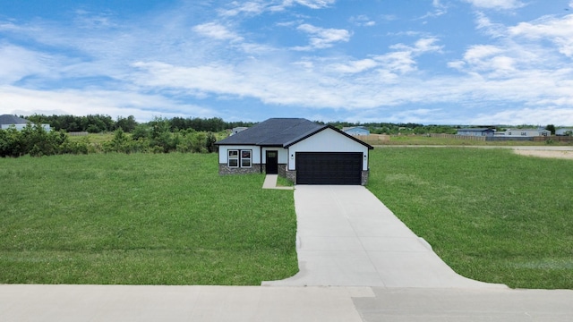 6273 Rd 5503, Cleveland, TX 77327 - view of front of home featuring a front yard, a garage, and driveway