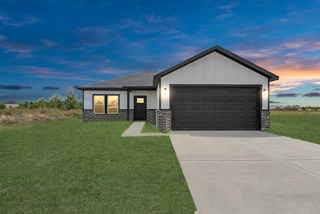 6273 Rd 5503, Cleveland, TX 77327 - view of front of home with a front lawn, a garage, driveway, board and batten siding, and roof with shingles