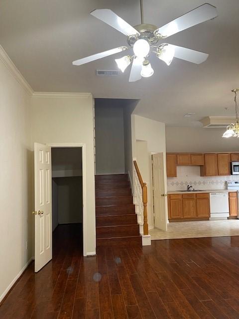 2710 Grants Lake Blvd Unit S4, Sugar Land, TX 77479 - unfurnished living room with wood finished floors, ornamental molding, a sink, ceiling fan, and stairway