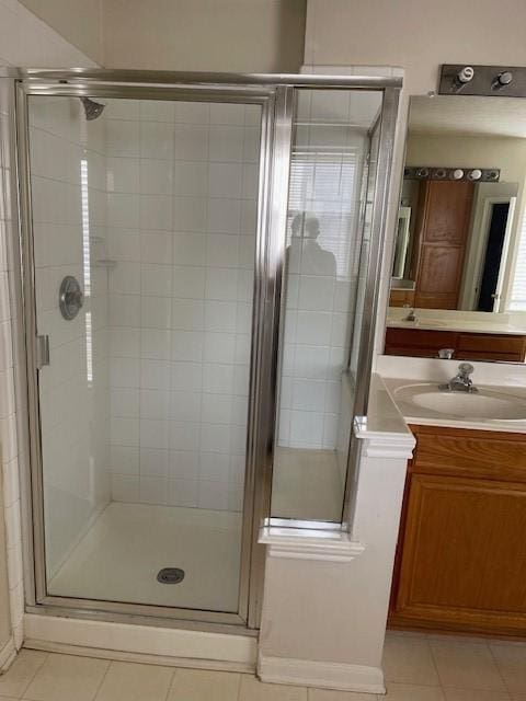 2710 Grants Lake Blvd Unit S4, Sugar Land, TX 77479 - full bathroom with tile patterned flooring, a shower stall, vanity, and baseboards