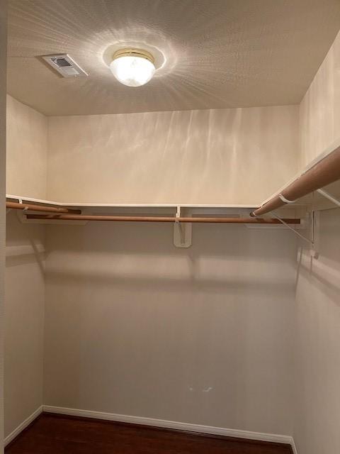 2710 Grants Lake Blvd Unit S4, Sugar Land, TX 77479 - walk in closet with dark wood finished floors