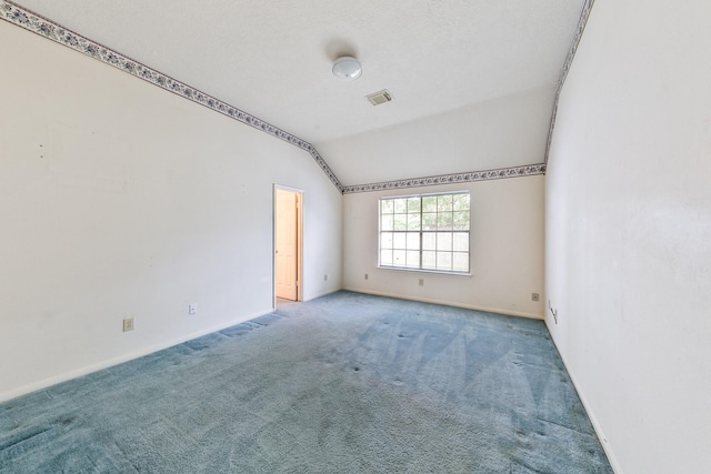7110 Pine Bower Ct, Humble, TX 77346 - unfurnished room featuring lofted ceiling, carpet flooring, and baseboards