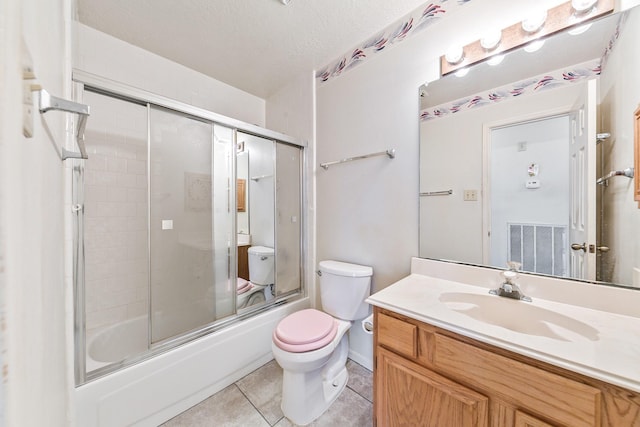 7110 Pine Bower Ct, Humble, TX 77346 - bathroom featuring tile patterned floors, toilet, shower / bath combination with glass door, and vanity