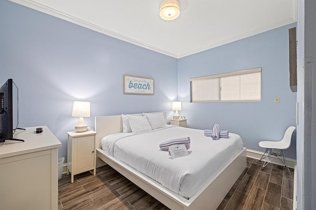 1401 E Beach Dr Unit 1205, Galveston, TX 77550 - bedroom featuring wood finish floors, baseboards, and ornamental molding