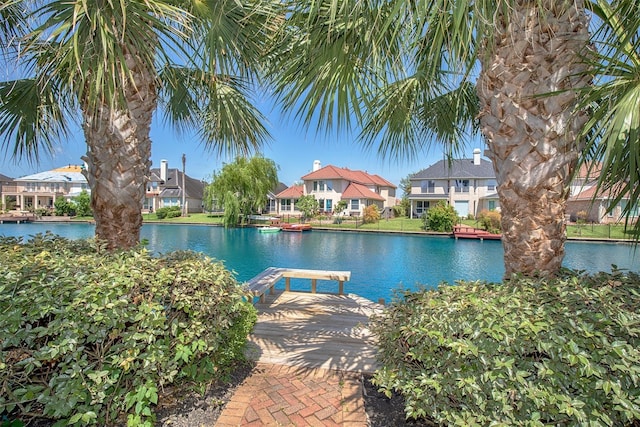 water view with nearby suburban area and a boat dock