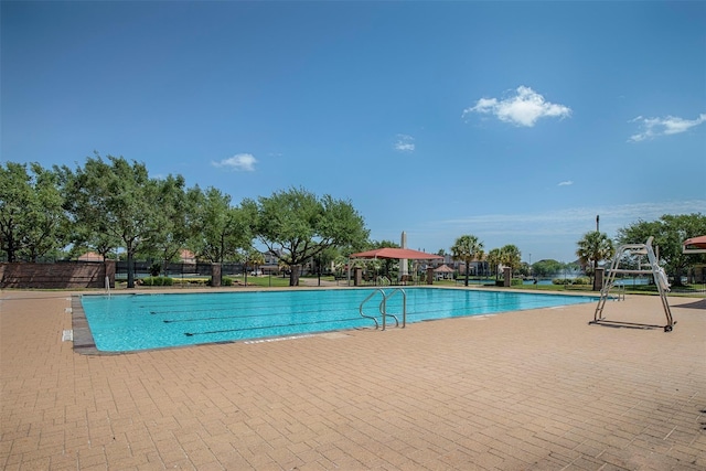 community pool featuring fence