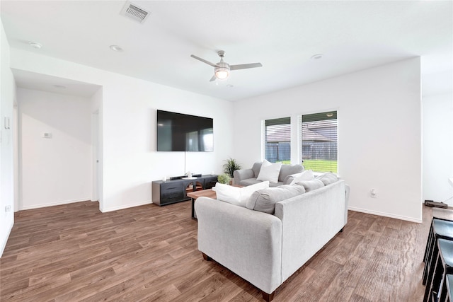 21614 Gusto Glen Ln, Katy, TX 77449 - living room featuring a ceiling fan, wood finished floors, and baseboards