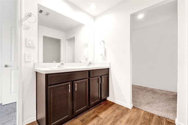 21614 Gusto Glen Ln, Katy, TX 77449 - bathroom with double vanity and wood finished floors